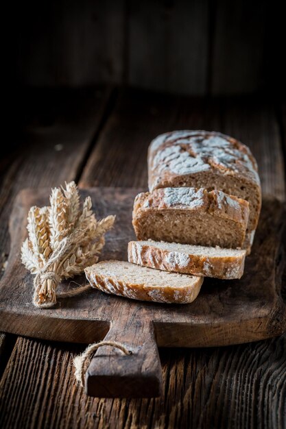 Healthy bread with grains and ears of wheat