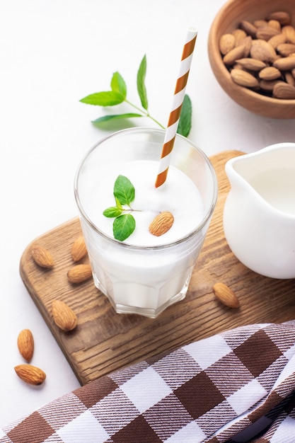 Healthy breakfast. Almond milkshake in a glass glass.