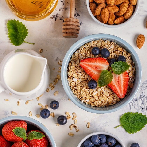 Healthy breakfast - a bowl of oatmeal, berries and fruit