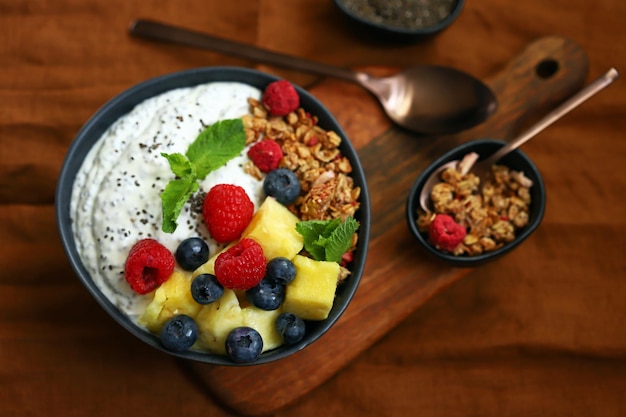 Healthy breakfast bowl with chia yogurt crunches and fruits