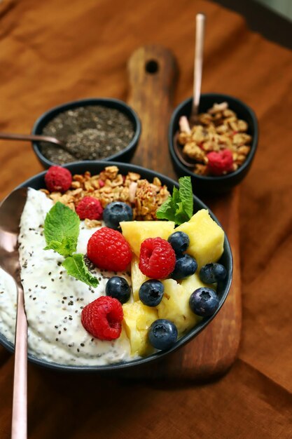 Healthy breakfast bowl with chia yogurt crunches and fruits