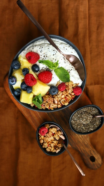 Healthy breakfast bowl with chia yogurt crunches and fruits