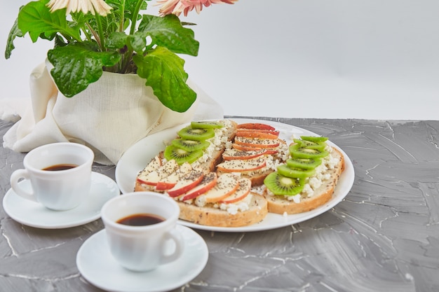 Healthy breakfast coffee, bouquet of flower and toasts