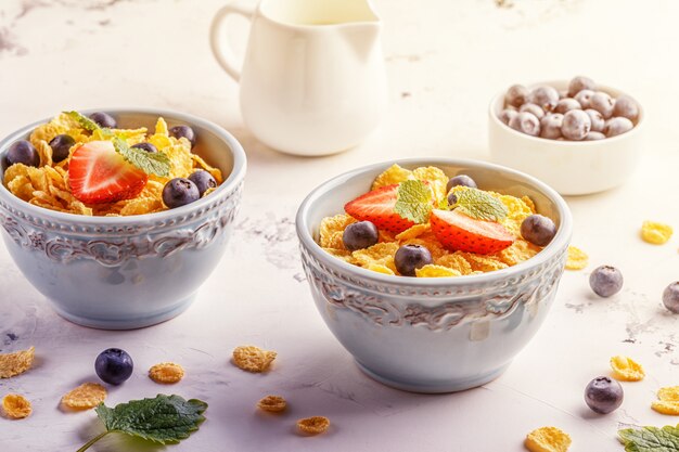 Healthy breakfast - corn flakes with fruits and berries.