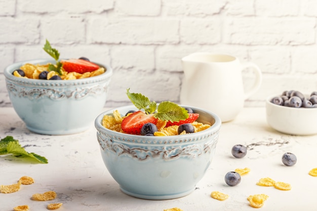 Healthy breakfast corn flakes with fruits and berries