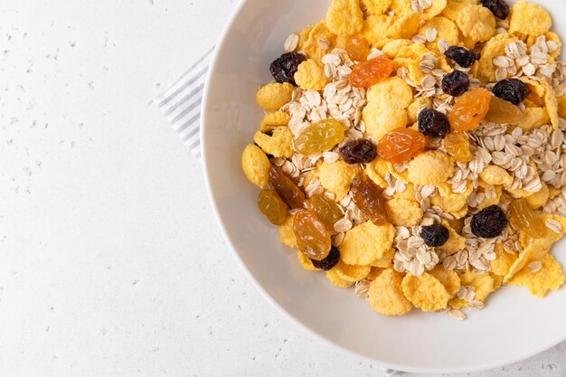 Healthy breakfast, diet culture. Fresh granola, muesli with raisins. Copy space