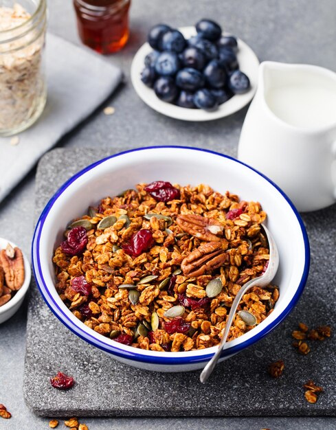 Healthy breakfast fresh granola muesli with pumpkinpecan nutscranberries and maple syrup