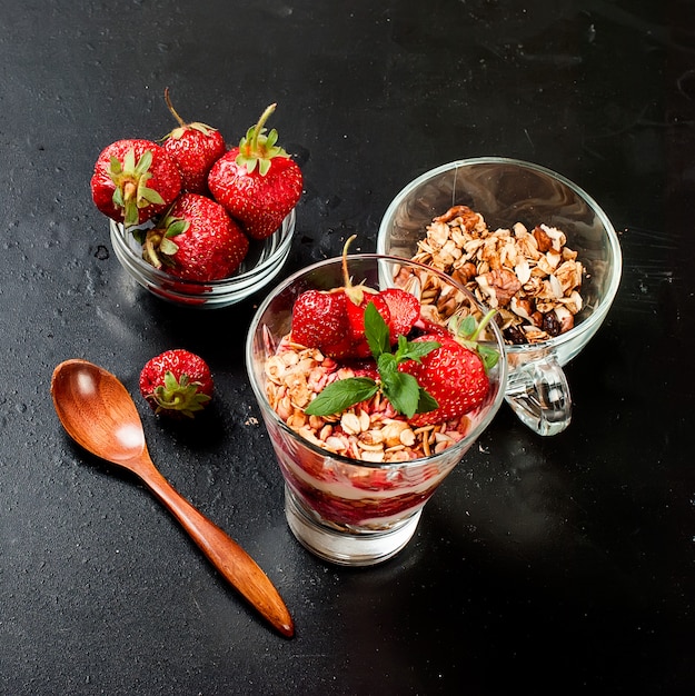 Healthy breakfast. Granola with  strawberry, honey, nuts, 