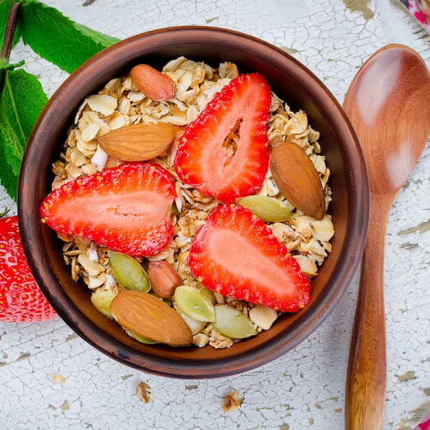 Healthy breakfast Homemade  granola with fresh strawberries 