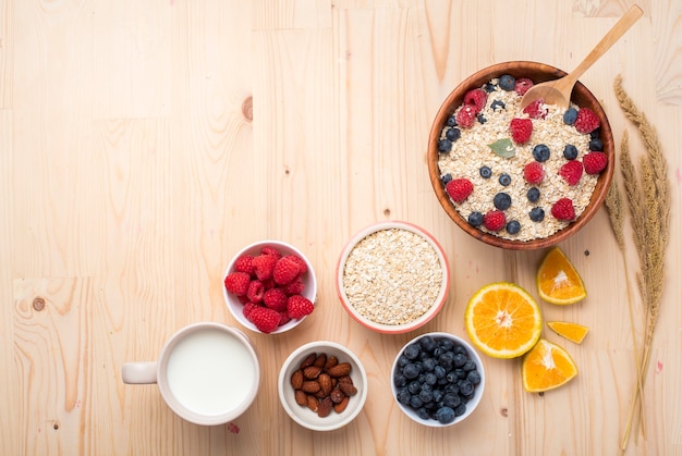 Photo healthy breakfast ingredients on wood table, healthy food concept