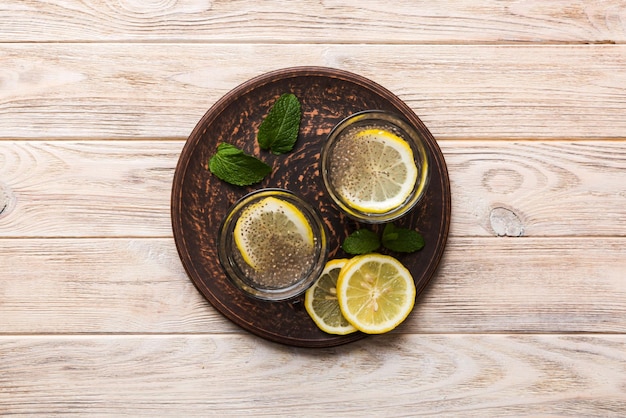 Healthy breakfast or morning with chia seeds lemon and mint on table background vegetarian food diet and health concept Chia pudding with lemon and mint