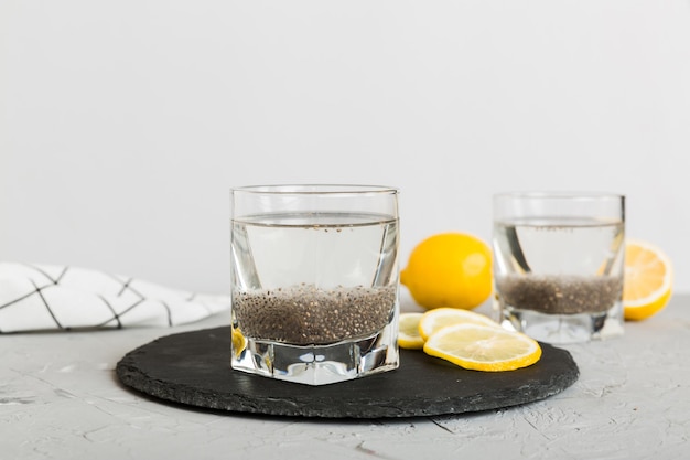 Photo healthy breakfast or morning with chia seeds and lemon on table background vegetarian food diet and health concept chia pudding with lemon