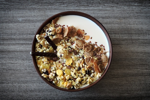 Healthy breakfast muesli with seeds and yogurt in a bowl