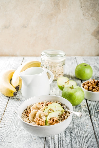 Healthy breakfast oatmeal with nuts ad fruits
