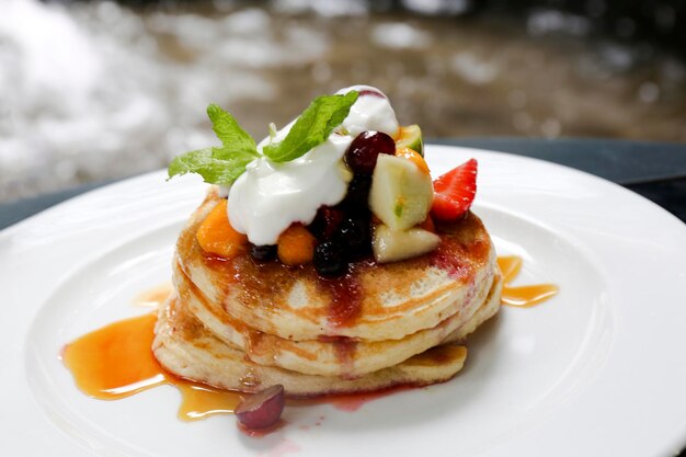 healthy breakfast pancakes with fruit and cream