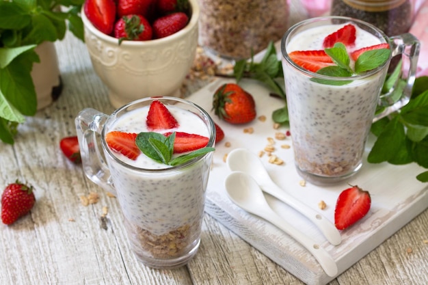 Healthy breakfast Strawberry parfait with yogurt chia seeds homemade granola and fresh berries