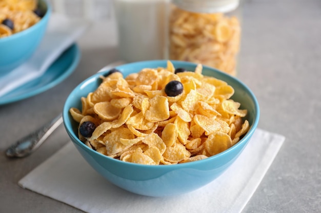 Healthy breakfast with corn flakes on table