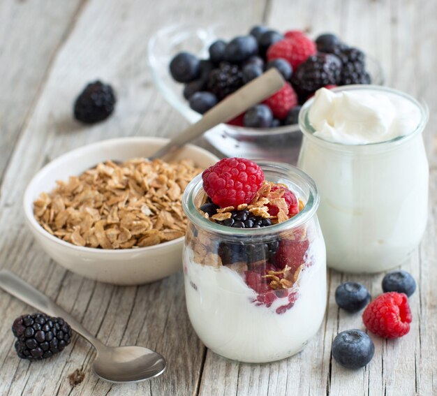 Healthy breakfast with Fresh greek yogurt, flakes and berries