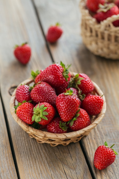 Healthy breakfast with ripe sweet berries. Fresh strawberries in basket