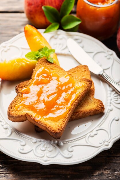 Healthy breakfast with toast and peach jam