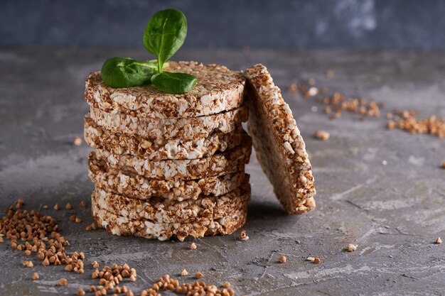 Healthy buckwheat crispbreads on a dark background