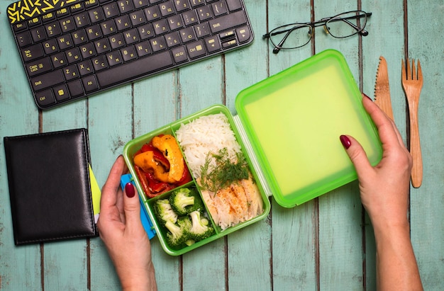 Healthy business lunch at workplace Healthy food concept lunch box with chicken rice broccoli