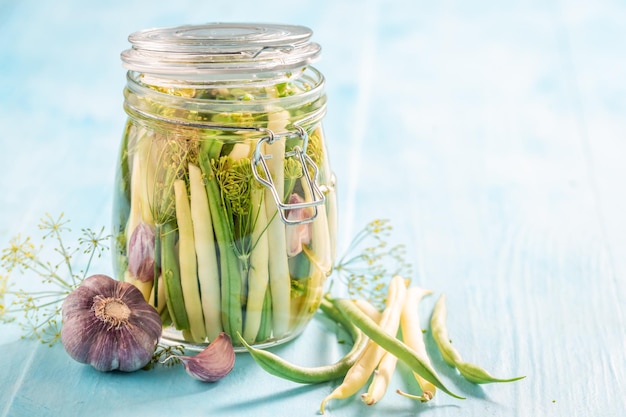Healthy canned yellow and green beans with galic and dill