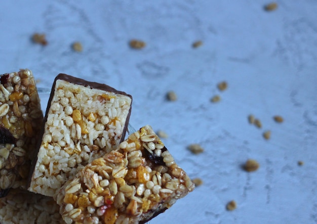 Healthy cereal fitness bars in a glass saucer on a gray background