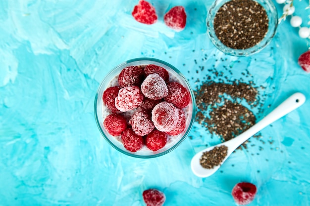 Healthy chia pudding with raspberries in glass