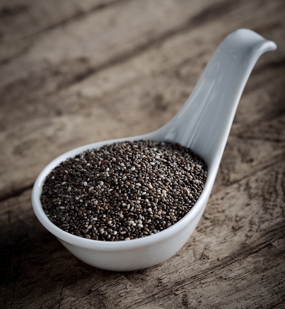 Healthy Chia seeds in spoon on the table.