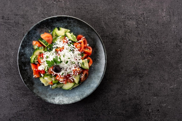 Healthy Chinese cabbage salad in plate on black background