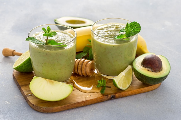 Healthy clean eating, Glass mug with green health smoothie on a table