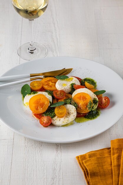 Healthy cobb salad in plastic package for take away on white background quail eggs cherry tomato