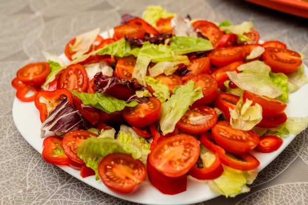 Healthy colorful mix vegetables on white plate Diet menu