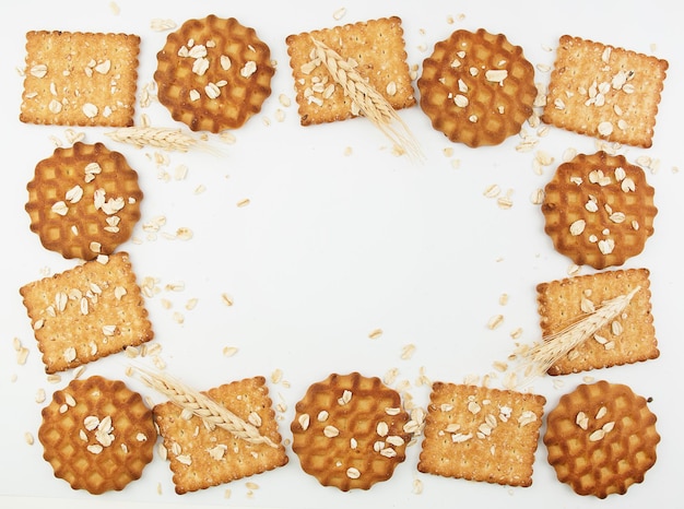 Foto biscotti e cracker sani e deliziosi avena e grano sullo sfondo copia spazio ricette cornice