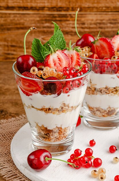 Healthy dessert of granola with yogurt and fresh berries