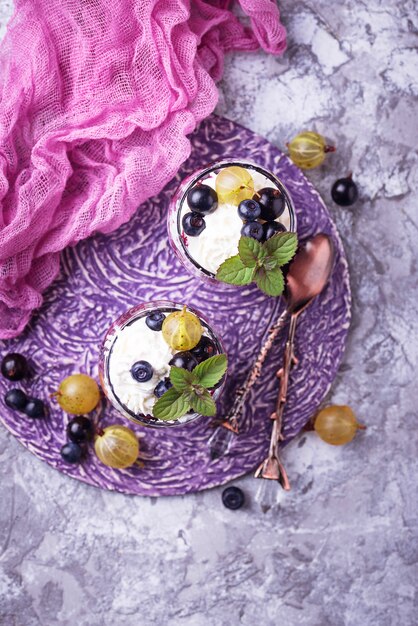 Healthy dessert with berry and cream cheese. Top view