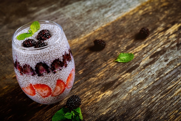 Healthy dessert with chia seeds and berries close-up