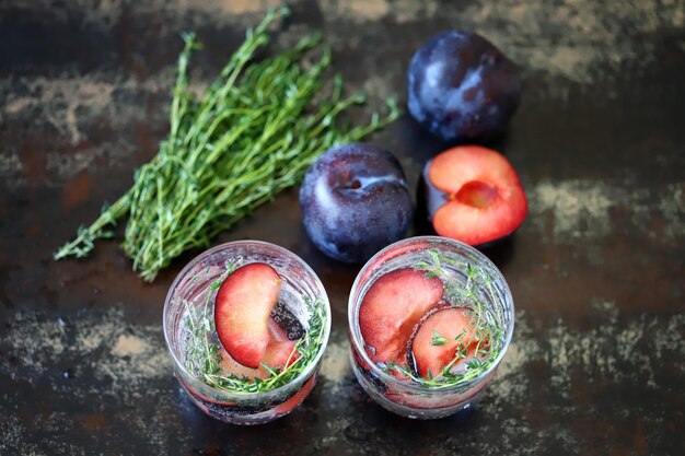 Healthy detox drink plum thyme Mineral water with thyme and plum