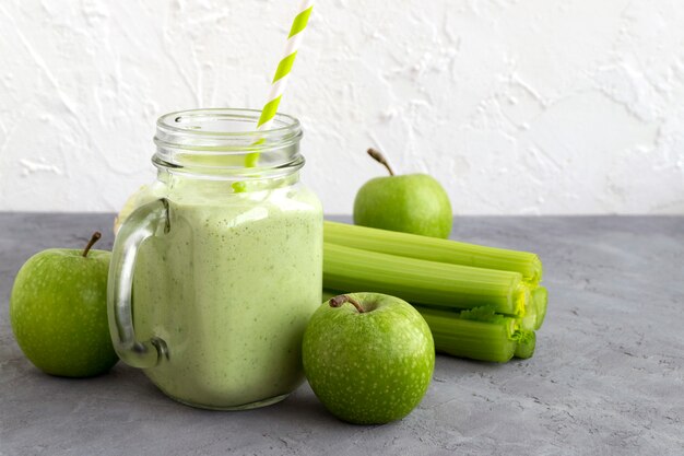 Healthy detox green smoothie in a mason jar.