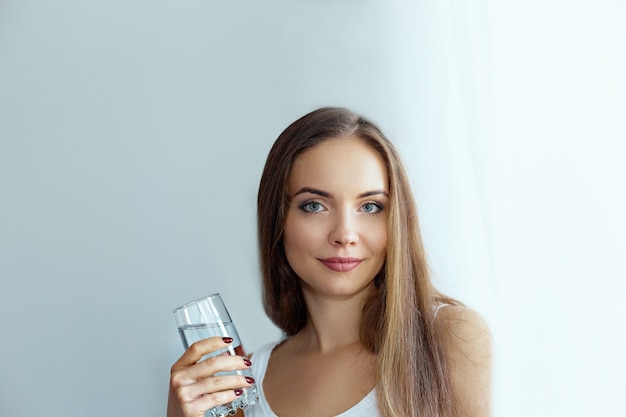 Healthy Diet Nutrition. Portrait Of Beautiful  Young Woman Taking Vitamin Pill