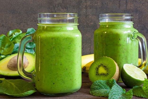 Healthy drink. green smoothie with banana, spinach, avocado,