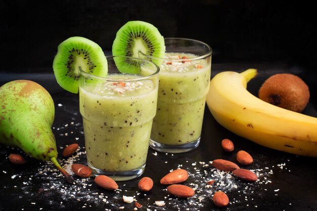 Healthy drink with kiwi, pear, banana and oat bran.