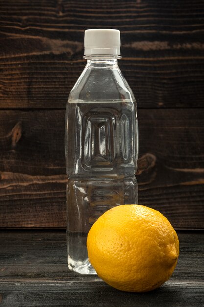 Healthy drinking - lemon and lemonade in plastic bottle