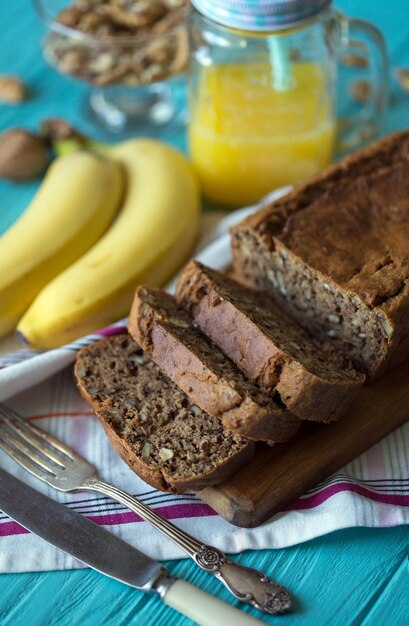 Healthy eating. Banana bread, bananas and orange juice on the table