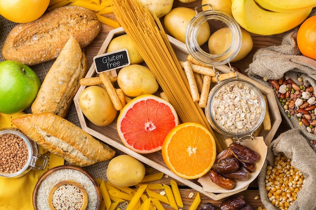 Healthy eating, dieting, balanced food concept. Assortment of gluten free food on a wooden table. Top view flat lay background