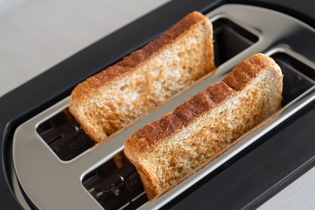 Healthy fashion food of breakfast. Toast in a toaster. 