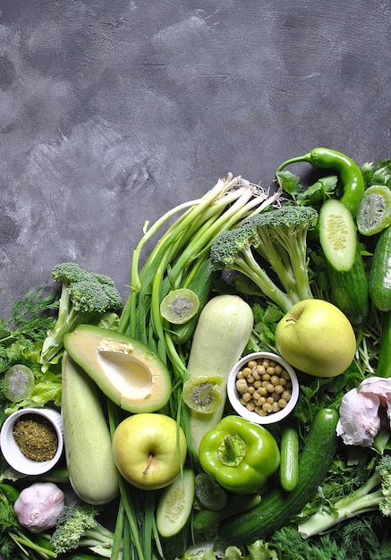 Healthy food background. Concept of healthy Food, Fresh vegetables and fruits. On gray wooden background. Top view. Copy space.