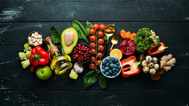 Healthy food background Concept of Healthy Food Fresh Vegetables Nuts and Fruits On a stone background Top view Copy space