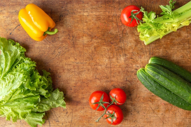 Healthy food background various fresh vegetables on an old wooden table